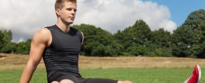 athlete stretching in the park