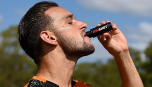 Male athlete drinking a HOTSHOT