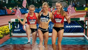 three Americans celebrating in water