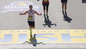Maria finishing the Boston Marathon