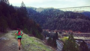 Cat Bradley running on trail