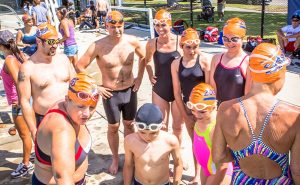 Athletes and children preparing for swim