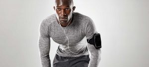 focused young man ready running music