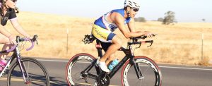 ironman cyclist on road