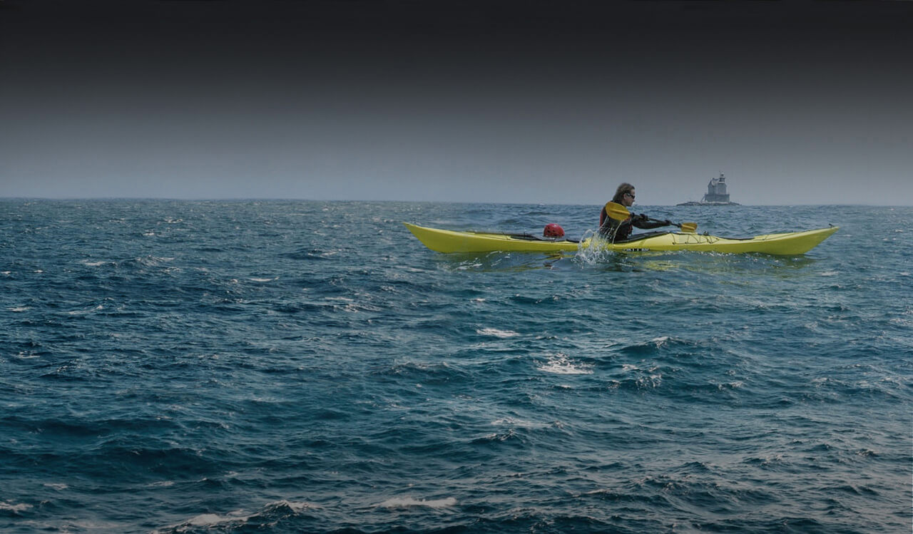 Man rowing in the ocean