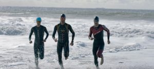 three athletes running out of water