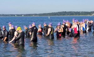 Athletes in water preparing for race to start