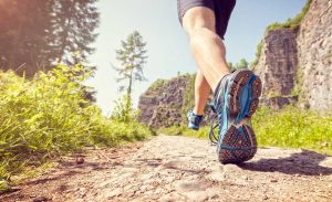 close up of runner on trail