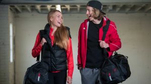 two athletes smiling with HOTSHOT gear