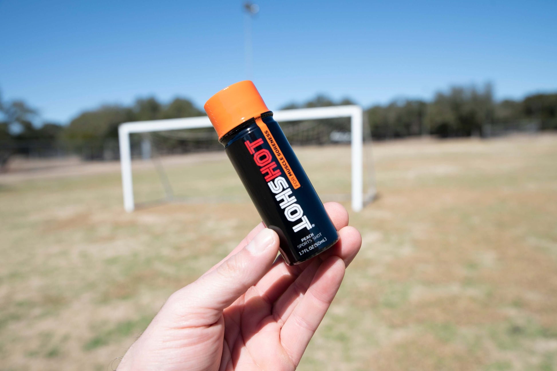 HOTSHOT for Muscle Soreness Peach Shot on Soccer Field